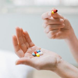 hands with vitamins - HCG Diet